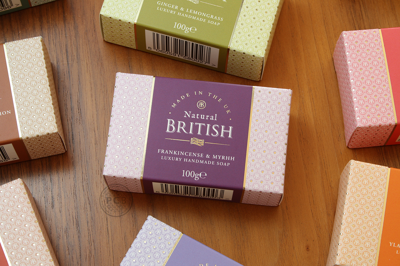 Scattered arrangement of colourful luxury handmade soap carton graphics designed by Paul Cartwright Branding.