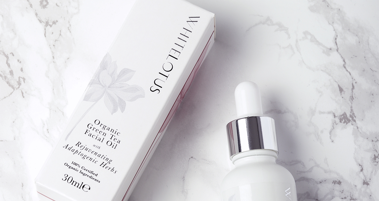 Close-up of White Lotus facial oil crystal beauty product graphics designed by Paul Cartwright Branding.