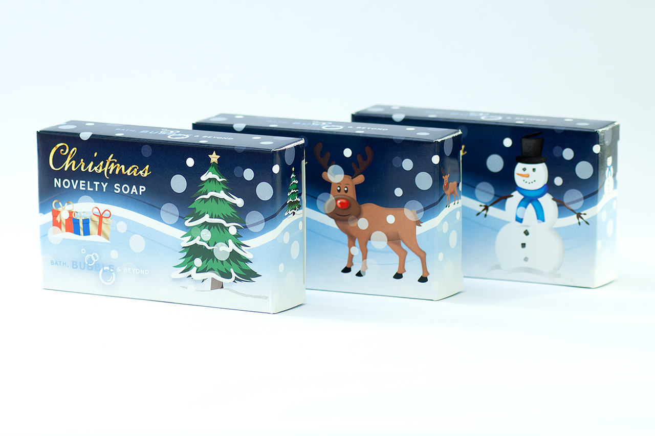 View of three products featuring fun Christmas soap box graphics designed by Paul Cartwright Branding.
