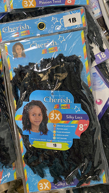 Image of pack of three silky locs hair braids for children.