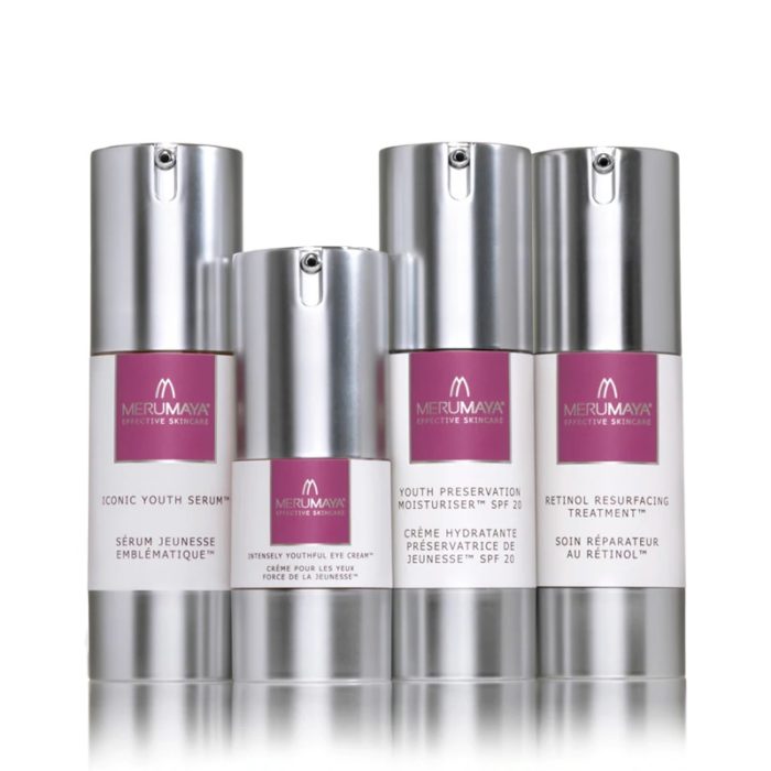 Image of four silver pump products with updated labels as part of skincare product graphic update project.